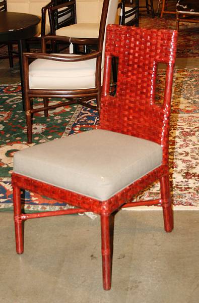 Appraisal: Two Thomas Pheasant rattan and woven leather chairs comprising one