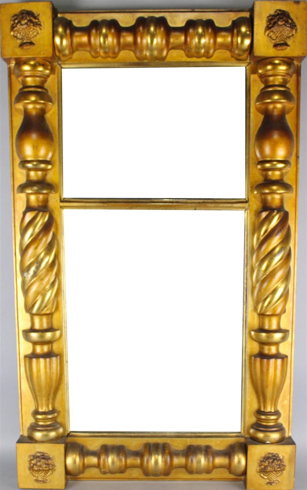 Appraisal: EMPIRE STYLE GOLD FRAMED MIRROR having basket carved corner blocks