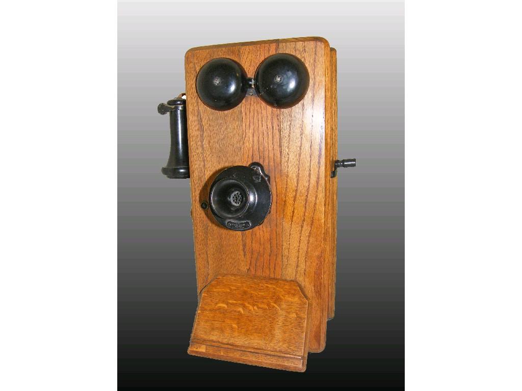 Appraisal: Oak cased American wall telephone comprising twin bells over adjustable