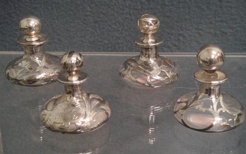 Appraisal: silver overlay scent bottles cracked stoppers with chips typical height