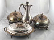 Appraisal: Three silver plated serving dishes a pair on scroll feet