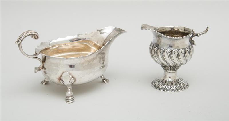 Appraisal: GEORGE II SILVER CREAMER AND A GEORGE III TRIPOD SAUCE