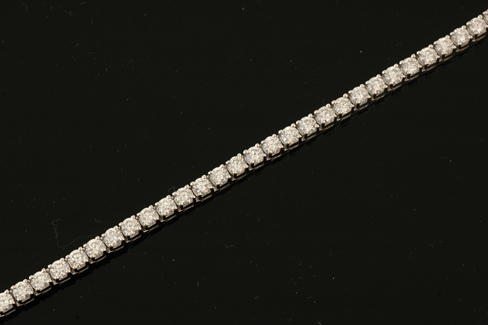 Appraisal: A diamond line bracelet Comprising forty six round brilliant cut