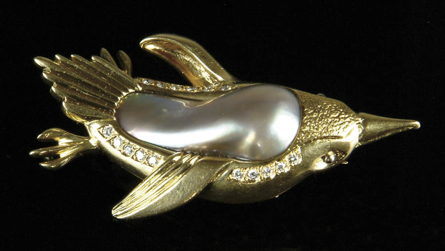 Appraisal: MOTHER OF PEARL DIAMOND AND K YELLOW GOLD PENGUIN PIN