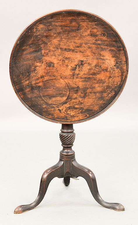 Appraisal: Mahogany tip table with round molded edge top on spiral