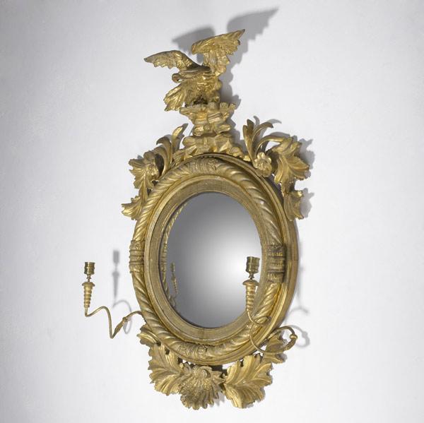 Appraisal: ENGLISH GIRANDOLE MIRROR Gilded with two candleholders eagle finial and