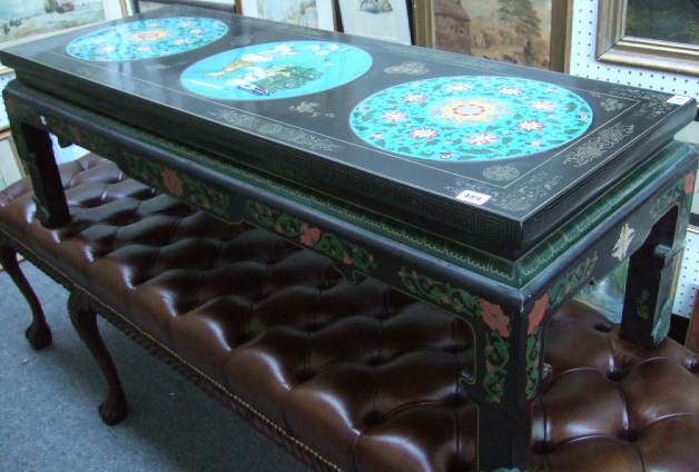 Appraisal: A th century lacquered coffee table with three inset cloisonne