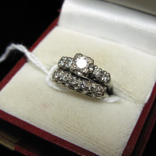 Appraisal: DIAMOND AND FOURTEEN KARAT WHITE GOLD WEDDING RING SET The