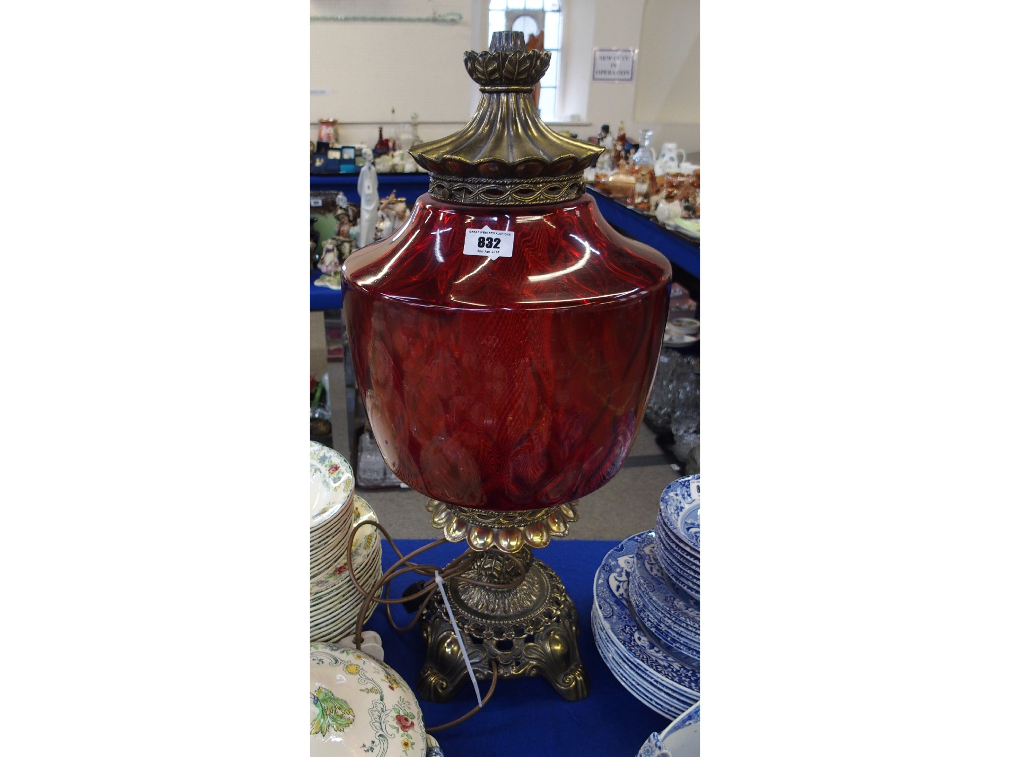 Appraisal: A large ruby glass and gilt metal table lamp