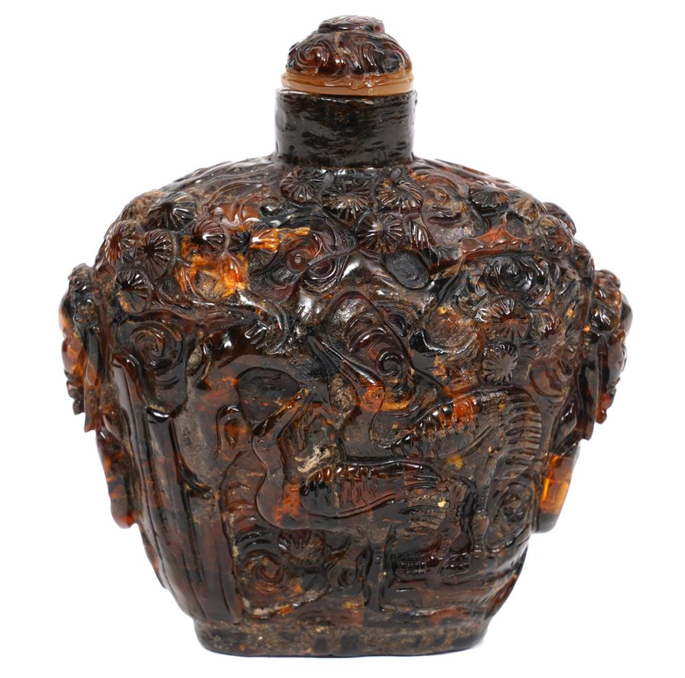 Appraisal: CHINESE AMBER SNUFF BOTTLE CARVED IN HIGH RELIEFChinese Amber snuff