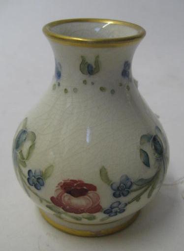 Appraisal: A MACINTYRE MOORCROFT EARTHENWARE MINIATURE VASE of baluster form tube