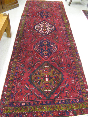 Appraisal: PERSIAN HERIZ RUNNER five geometric and stylized floral decoration on