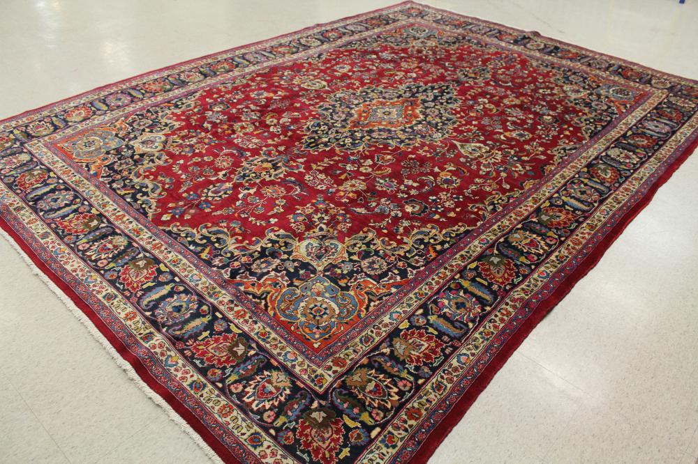 Appraisal: VINTAGE HAND KNOTTED PERSIAN CARPET floral and central floral medallion