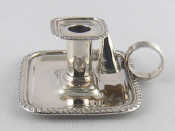 Appraisal: A small silver rectangular chamber candlestick with gadrooned rim and