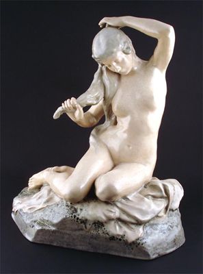 Appraisal: A L H Nigot earthenware figure of a nude washing