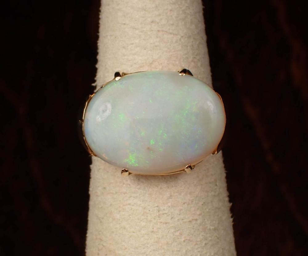 Appraisal: OPAL AND FOURTEEN KARAT GOLD SOLITAIRE RING The yellow gold