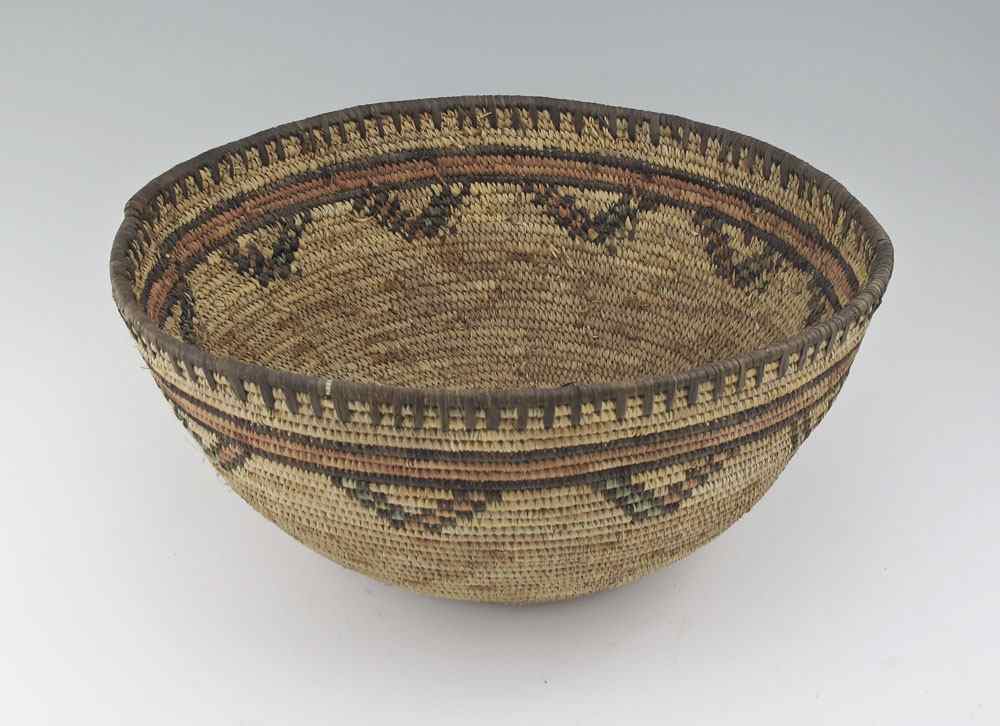 Appraisal: SOUTHWEST POLYCHROME COILED BASKET Coiled basket with red rings and