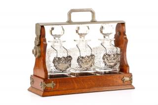 Appraisal: English Oak Locking Tantalus w Decanters English circa s An