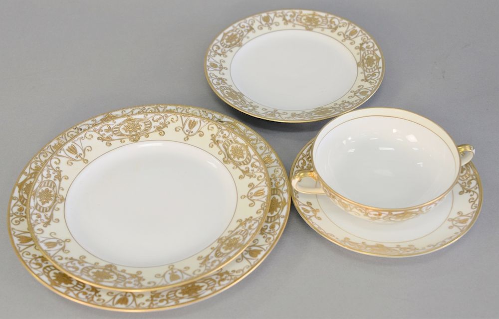 Appraisal: Noritake large dinnerware set with raised gold designs setting for