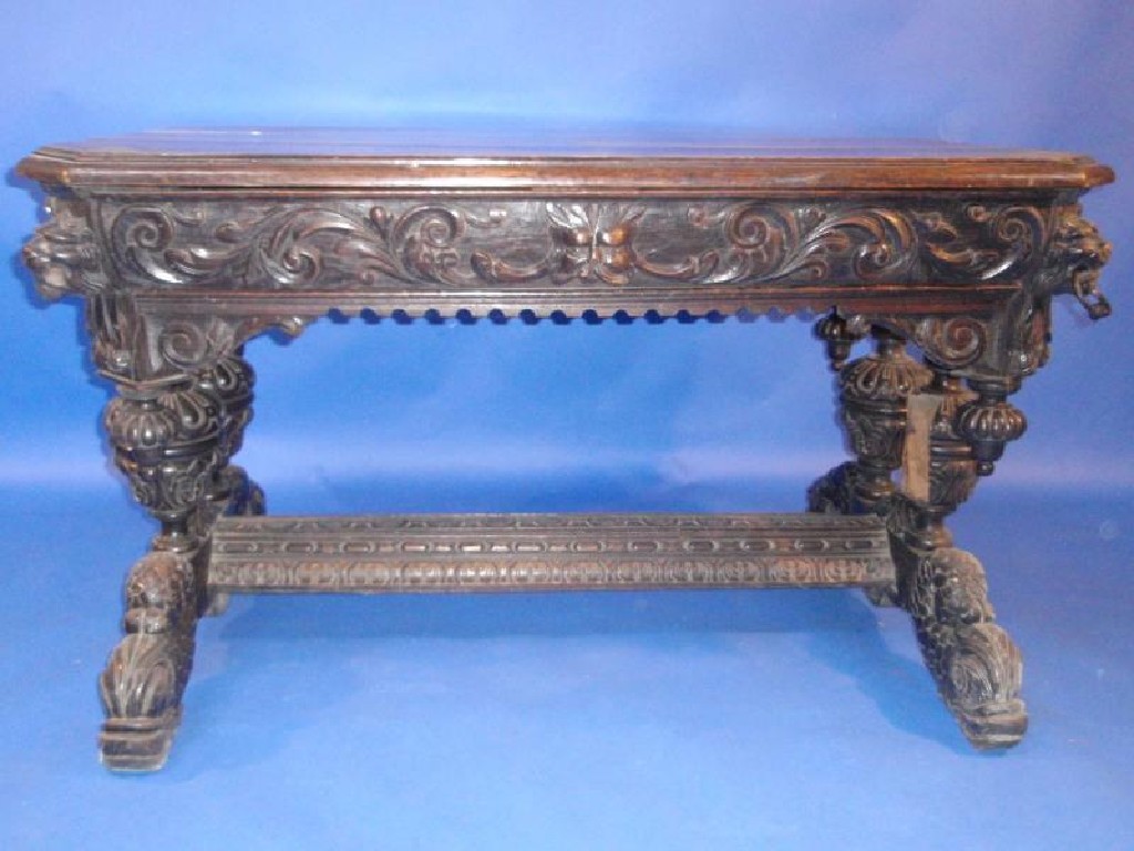 Appraisal: A thC oak centre table with profusely carved frieze with