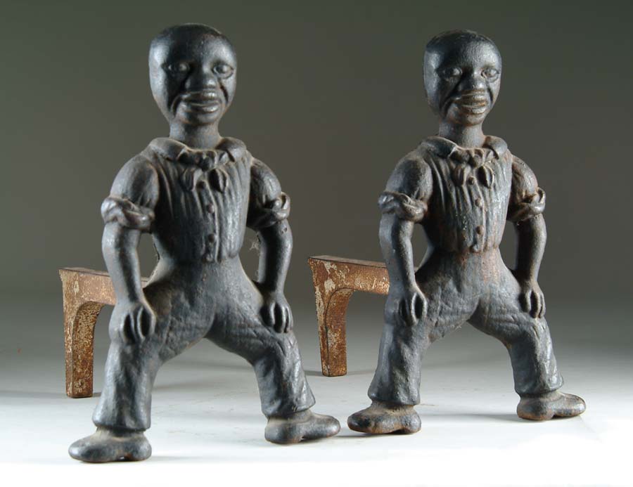 Appraisal: PAIR OF BLACK ANDIRONS Heavily cast iron andirons depicting spread