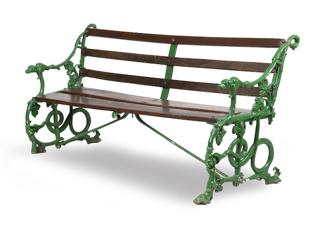 Appraisal: A Victorian cast-iron garden bench The wooden slatted back enclosed