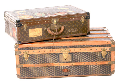 Appraisal: VINTAGE LUGGAGE Louis Vuitton suitcase complete with traveling stickers Goyard