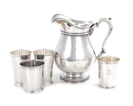 Appraisal: International Prelude pattern sterling pitcher and julep cups circa marked