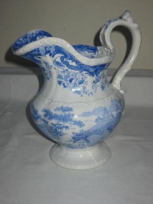 Appraisal: AN OPAQUE CHINA ENGLISH JUG of baluster form with loop