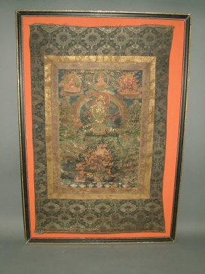 Appraisal: A th century Tibetan T'angka painted on fabric depicting the