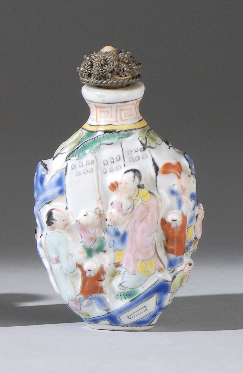 Appraisal: MOLDED PORCELAIN SNUFF BOTTLE th CenturyWith relief figural landscape design