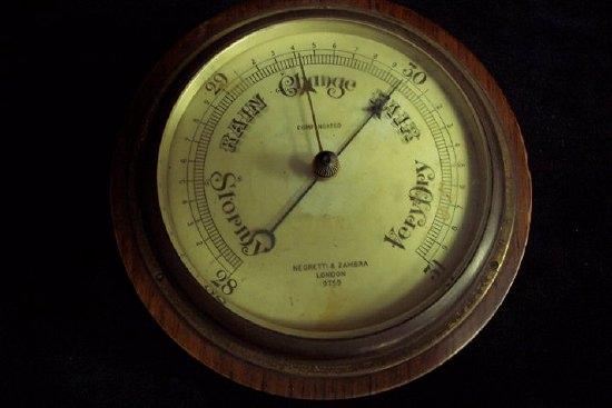 Appraisal: An aneroid barometer by Negretti and Zambra London the circular