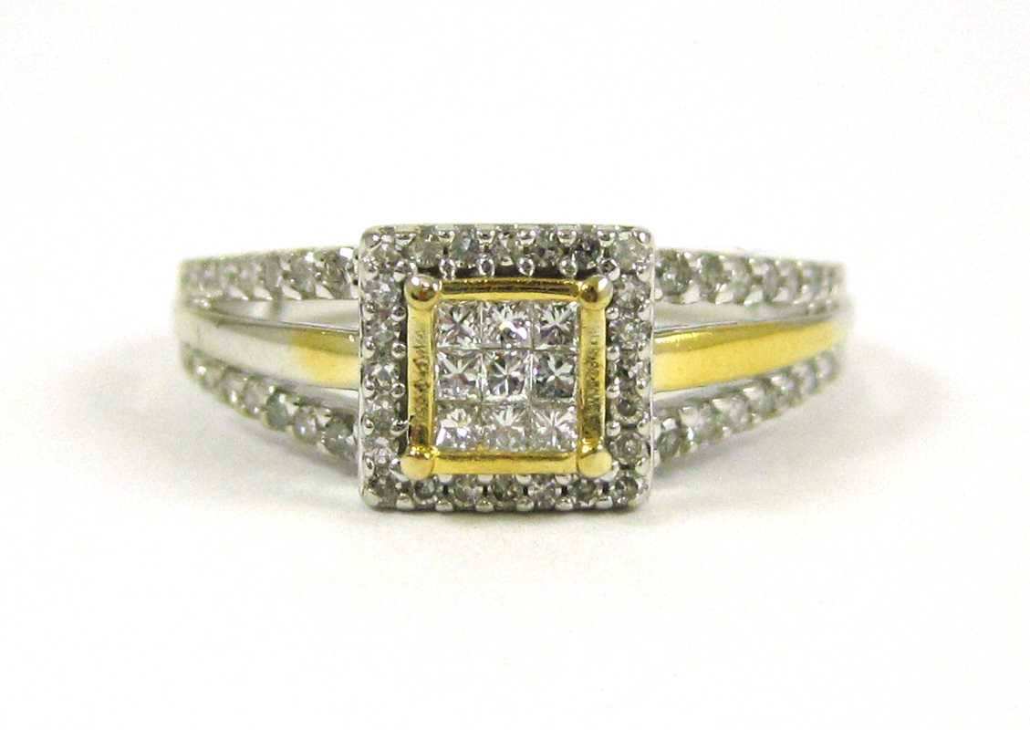 Appraisal: DIAMOND AND TEN KARAT TWO-TONE GOLD RING The white and