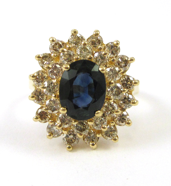 Appraisal: SAPPHIRE DIAMOND AND FOURTEEN KARAT GOLD RING with round-cut diamonds