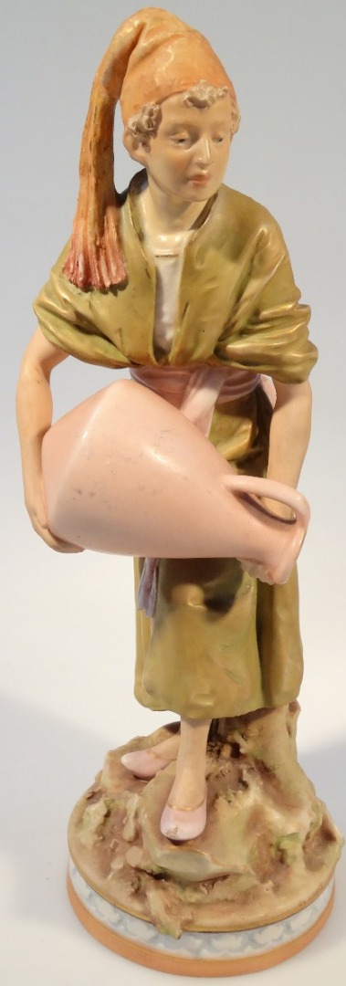 Appraisal: An early thC Royal Dux figure of a water carrier