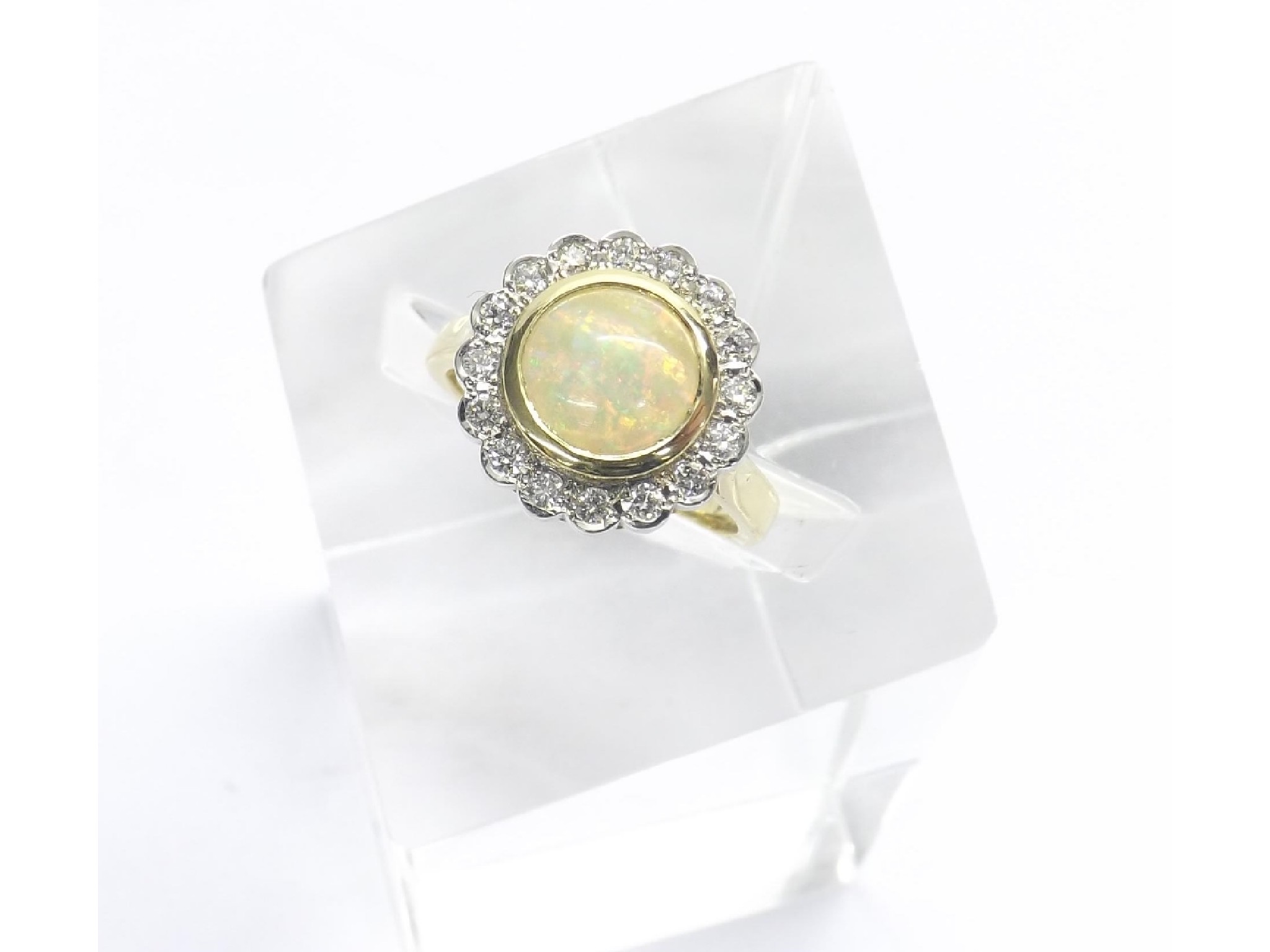 Appraisal: Attractive ct yellow gold opal and diamond cluster ring the