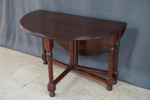 Appraisal: Dark Knotty Pine Gateleg Drop Leaf Dining Table The table