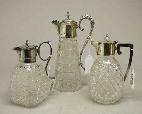 Appraisal: Three silver plate mounted cut glass claret jugs late th