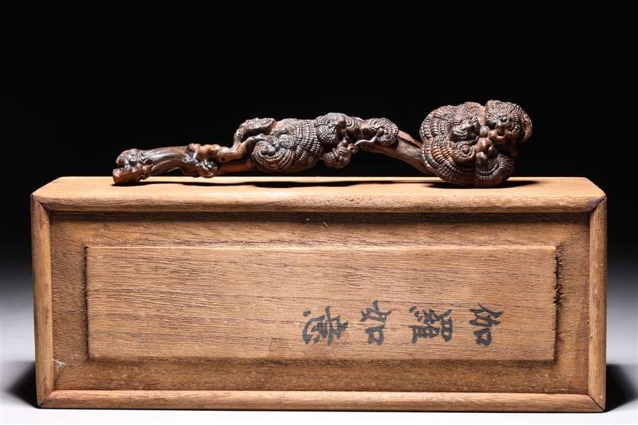 Appraisal: Elaborately carved Chinese wood ruyi scepter with overall detailed fungus