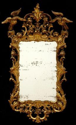 Appraisal: GEORGE III-STYLE GILTWOOD MIRROR The rectangular frame with cresting supporting