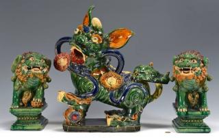 Appraisal: Buddhist Lion Pottery Figures Three large Chinese Sancai glazed Buddhist