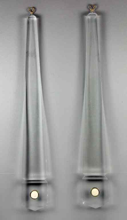 Appraisal: Pair Mid-Century Modern Lucite Wall HangingsOf exclamation-point shape having inset