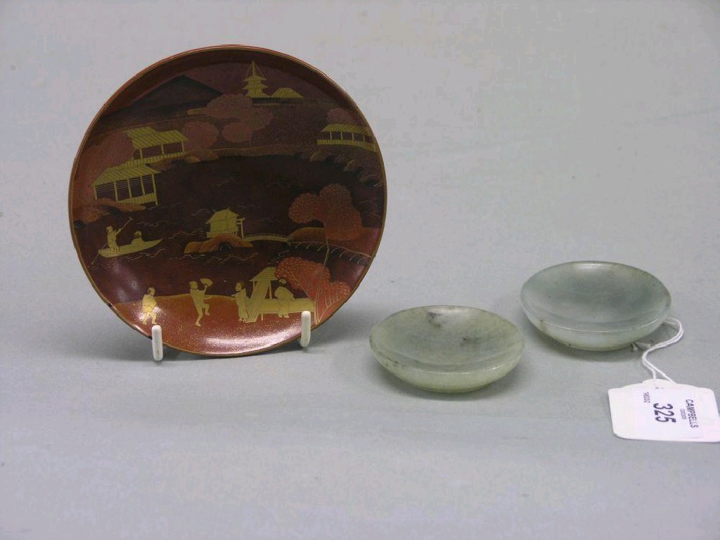 Appraisal: A pair of green jade snuff dishes in two Japanese