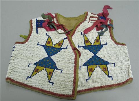 Appraisal: SIOUX CHILD'S BEADED HIDE VEST Tanned hide with sinew-sewn beads