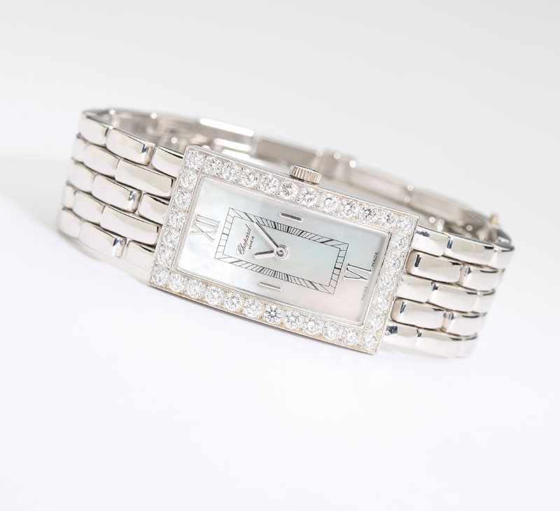 Appraisal: The rectangular and curved mother of pearl dial with applied