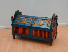 Appraisal: A painted timber blanket box in red blue and yellow