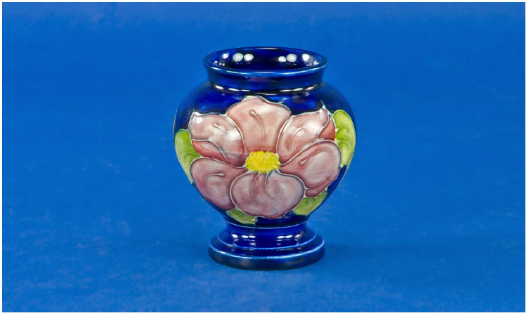 Appraisal: Moorcroft Vase clematis design on royal blue ground inches in