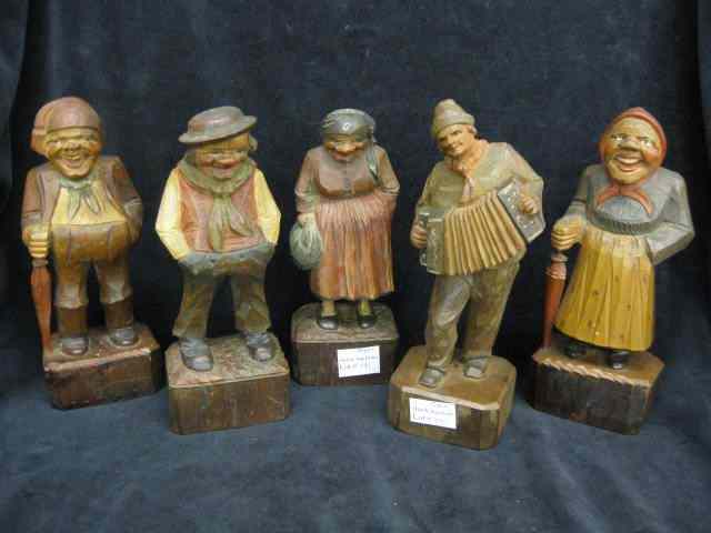 Appraisal: Carved Wooden Figures of Men Women Black Forest style ''