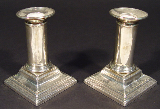 Appraisal: Pair of Victorian silver dwarf candlesticks on stepped square bases