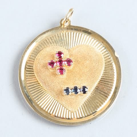 Appraisal: Flat round disk charm with round rubies and round cut